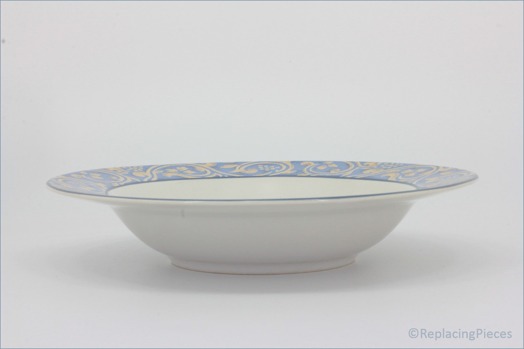 BHS - Seville - 9 1/4" Rimmed Bowl - White ceramic bowl with blue and yellow decorative rim on a white background