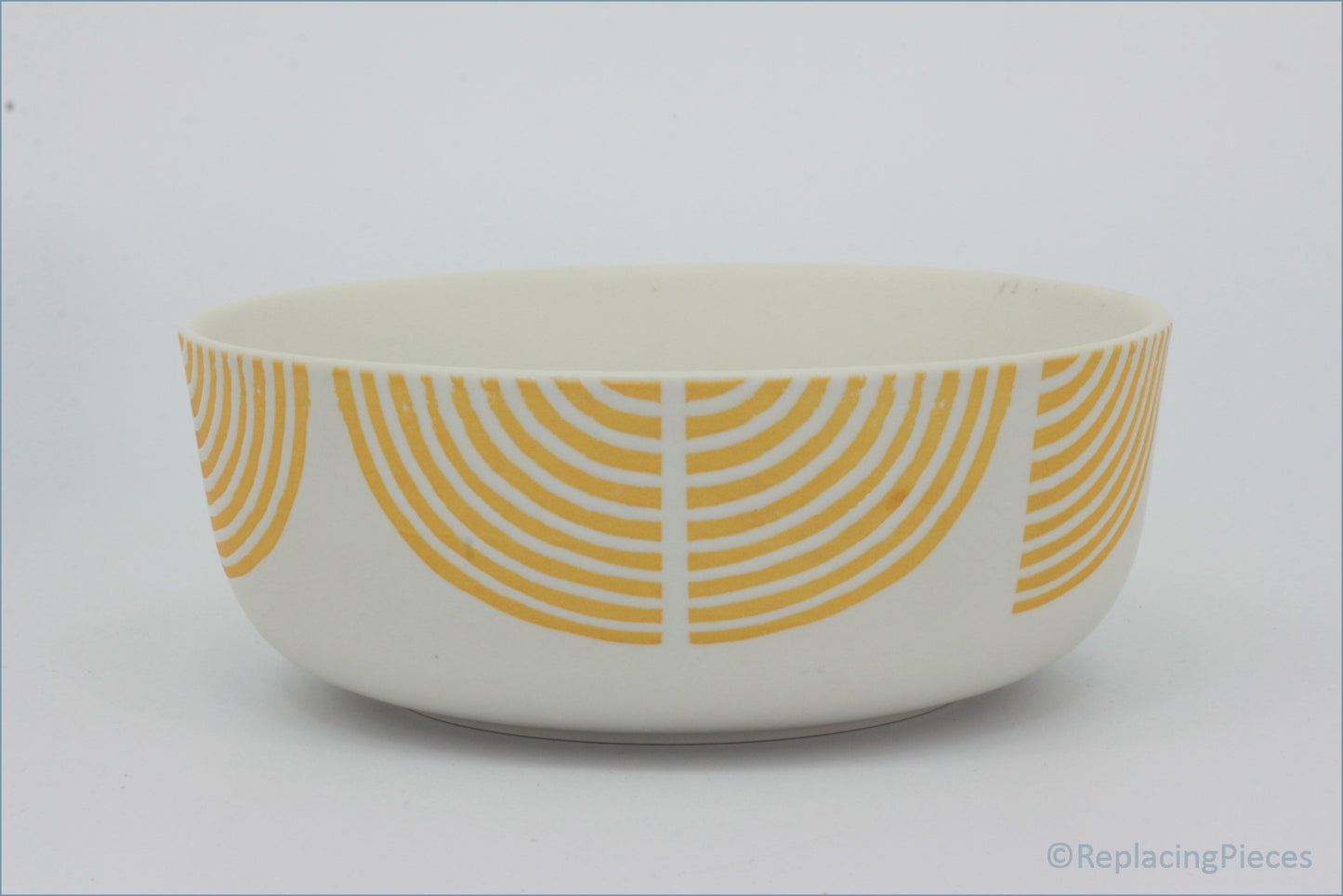 Habitat - Block Print - Cereal Bowl - White bowl with orange circular pattern on a white background