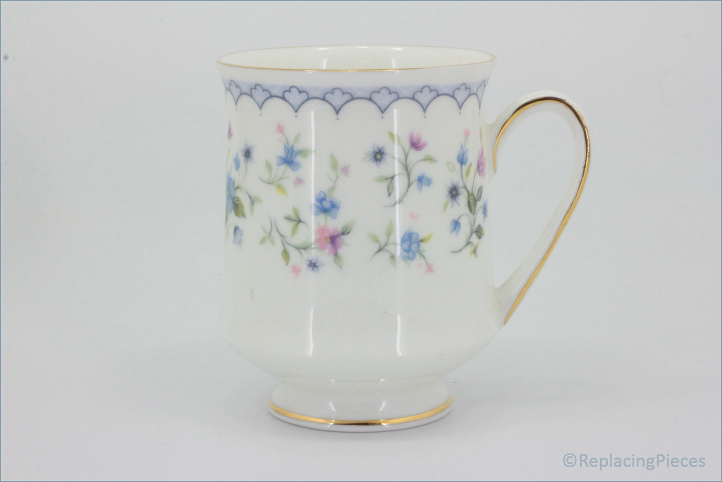 Paragon - Florabella - Coffee Cup - White ceramic cup with floral pattern and gold handle on a white background
