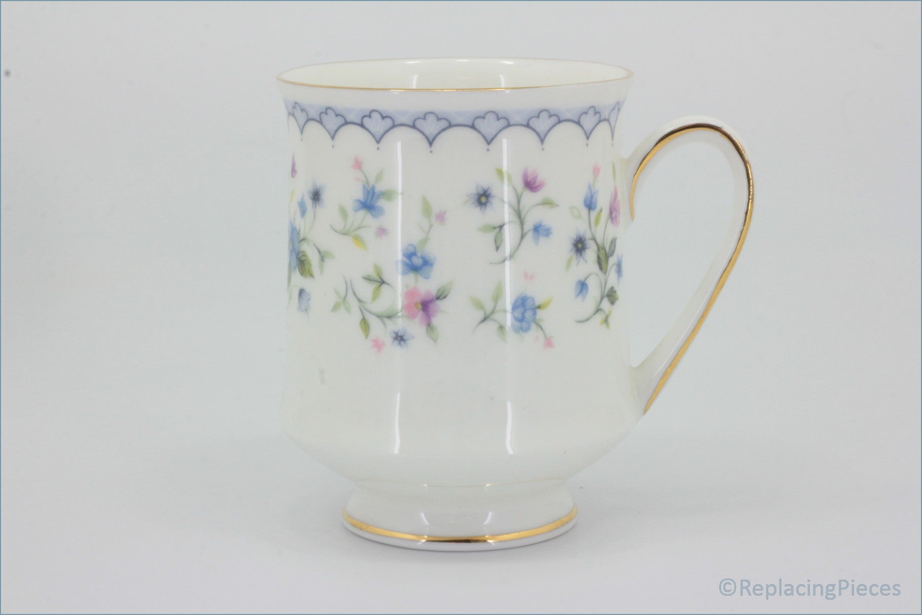 Paragon - Florabella - Coffee Cup  - White ceramic cup with floral pattern and gold handle on a white background