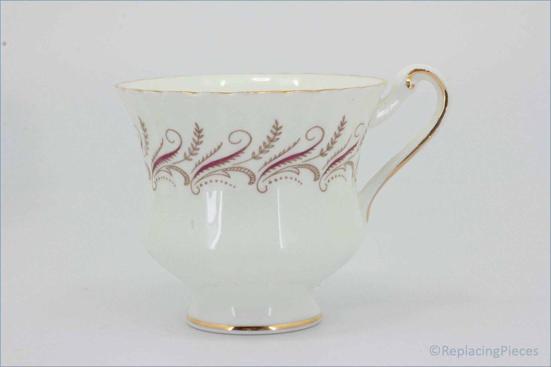 Paragon - Harmony - Teacup - White teacup with gold and red floral patterns on a white background