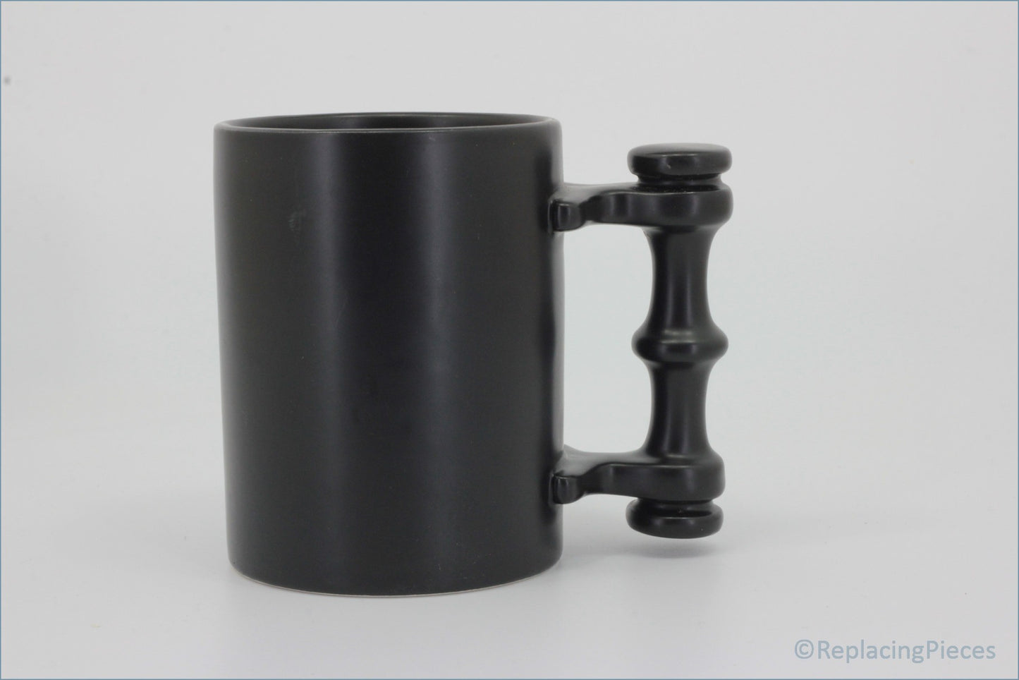 Portmeirion - Mugs - Plain Black Tankard - Black mug with a unique handle design on a white background