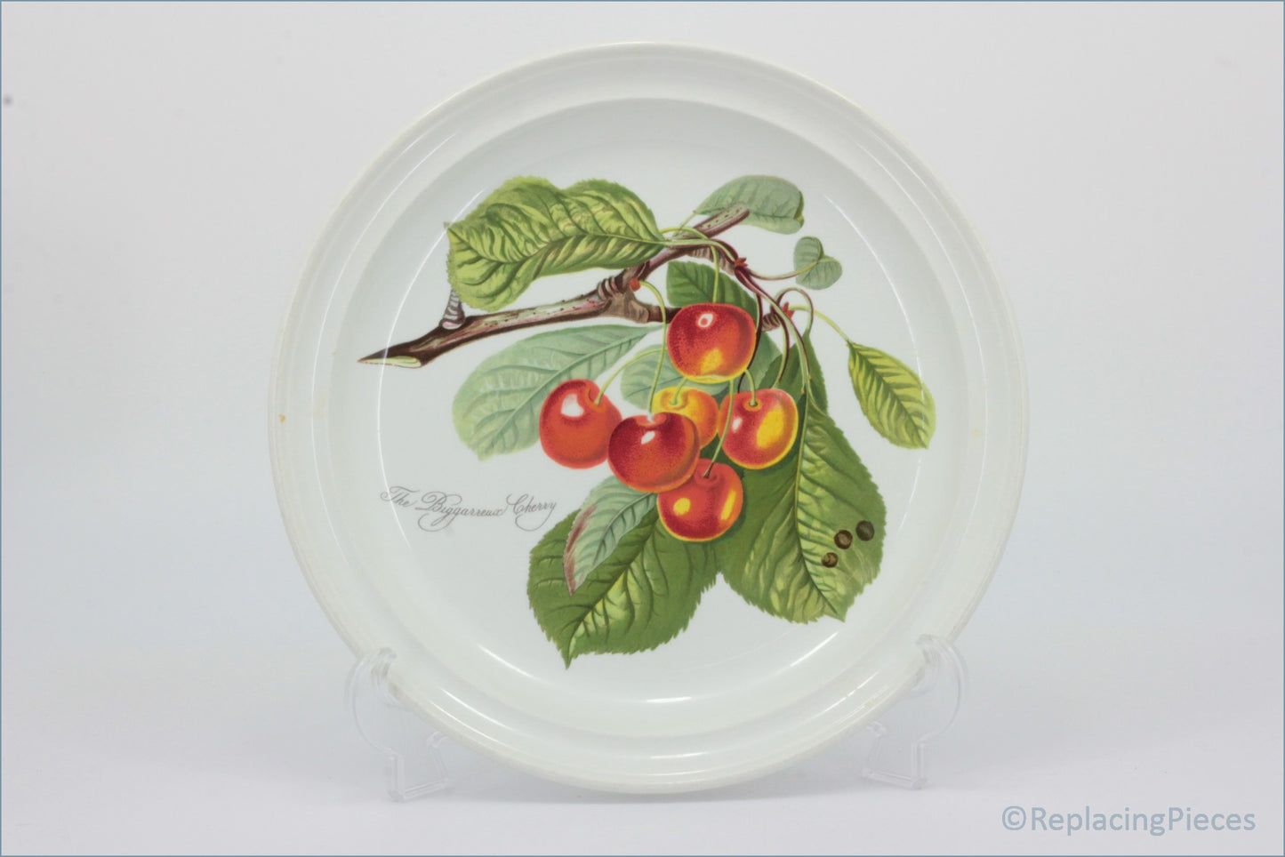 Decorative plate with a cherry design on a white background - Portmeirion - Pomona - Dinner Plate (The Biggarreux Cherry)