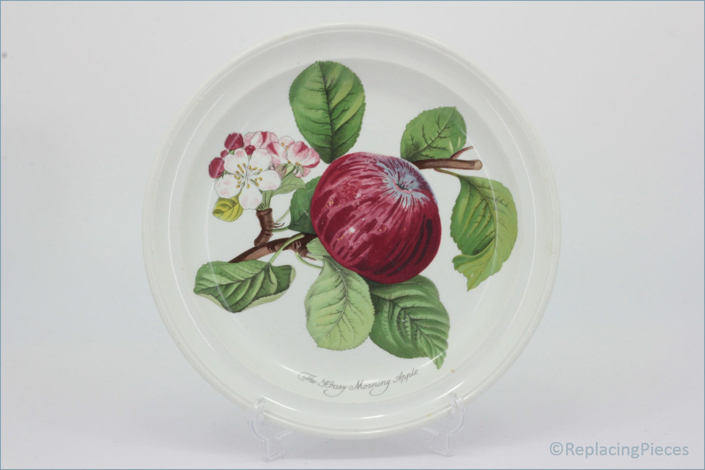 Decorative plate with a red apple and green leaves on a white background - Portmeirion - Pomona - 8 5/8" Salad Plate (Hoary Morning Apple)