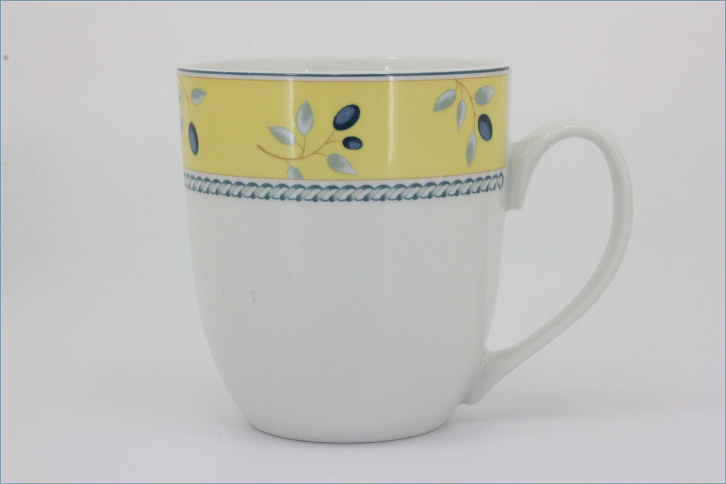 Royal Doulton - Blueberry (Yellow Rim) - Mug - White mug with yellow top section and blue floral design on a white background