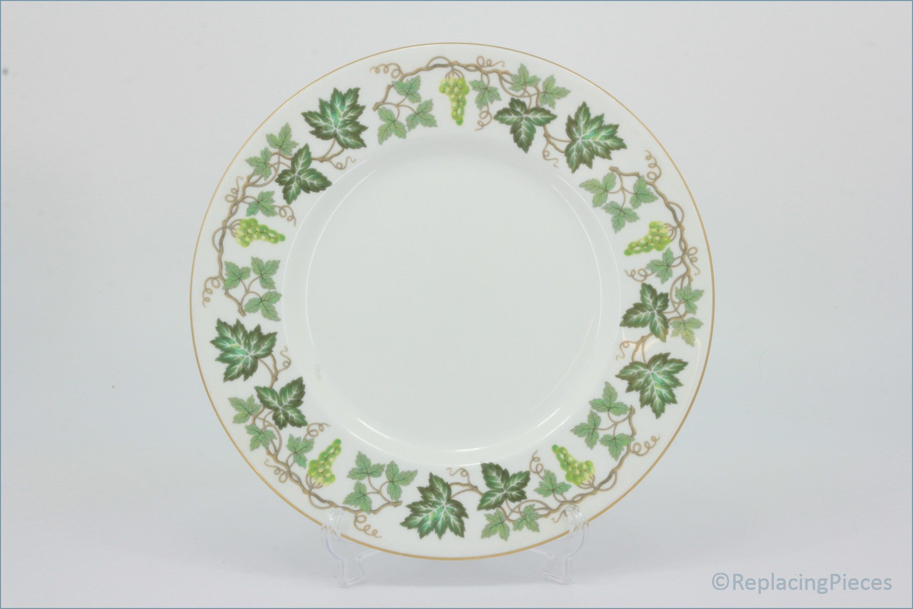 Wedgwood - Santa Clara - 9" Luncheon Plate - Decorative plate with green leaf pattern on a white background