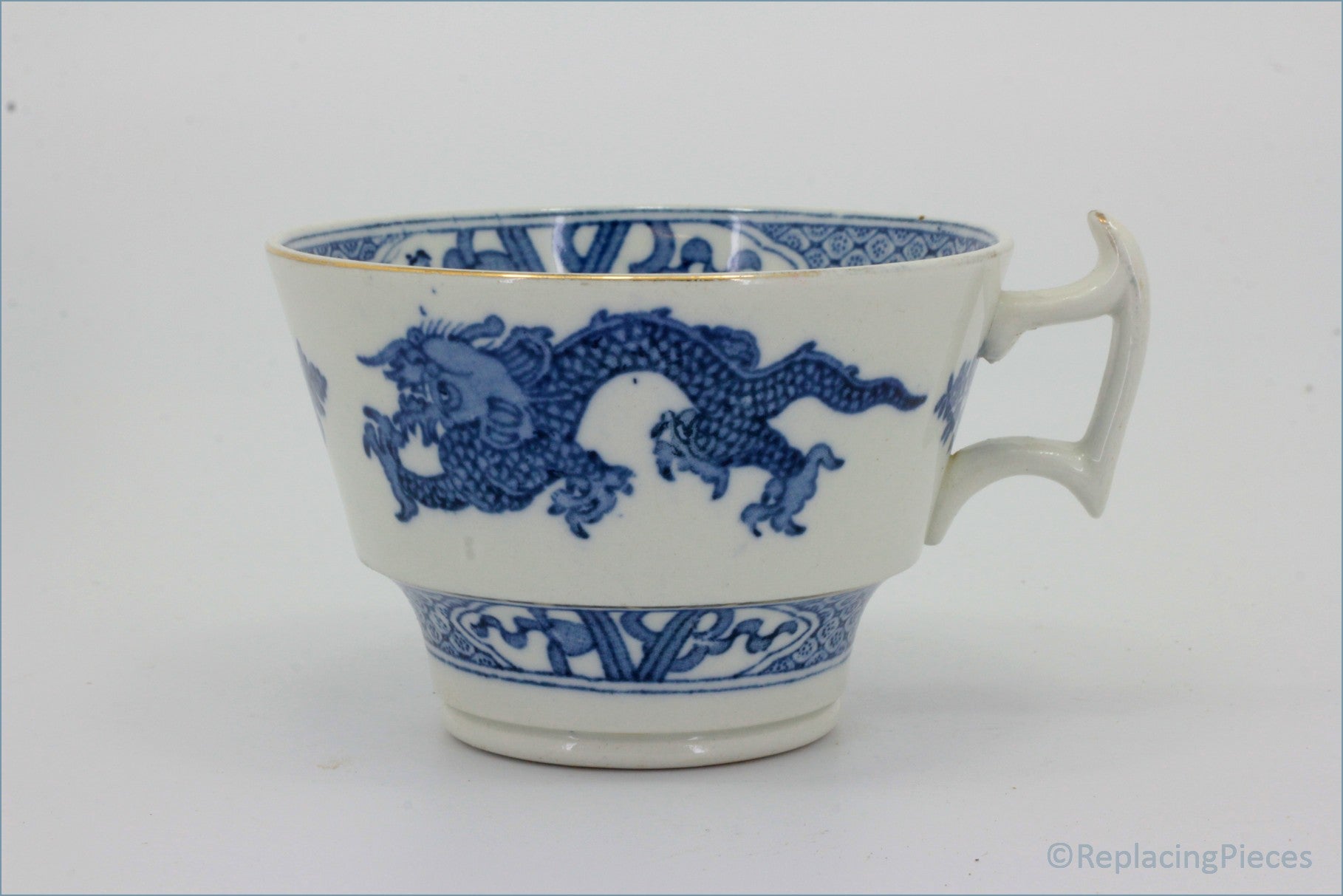Booths - Blue Dragon - Teacup - White ceramic cup with blue dragon design on a white background