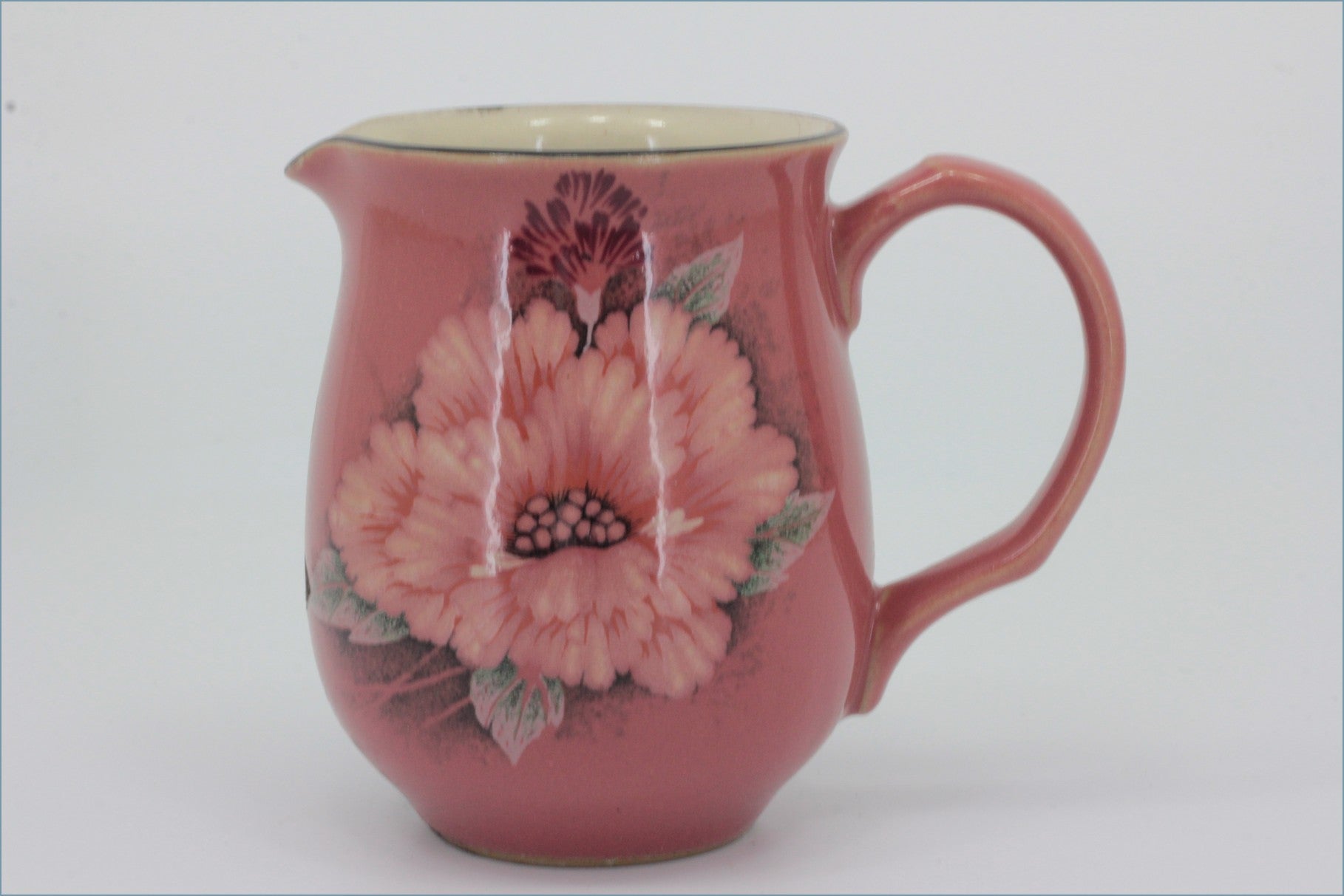 Denby - Damask - Milk Jug -Pink ceramic pitcher with floral design on a white background