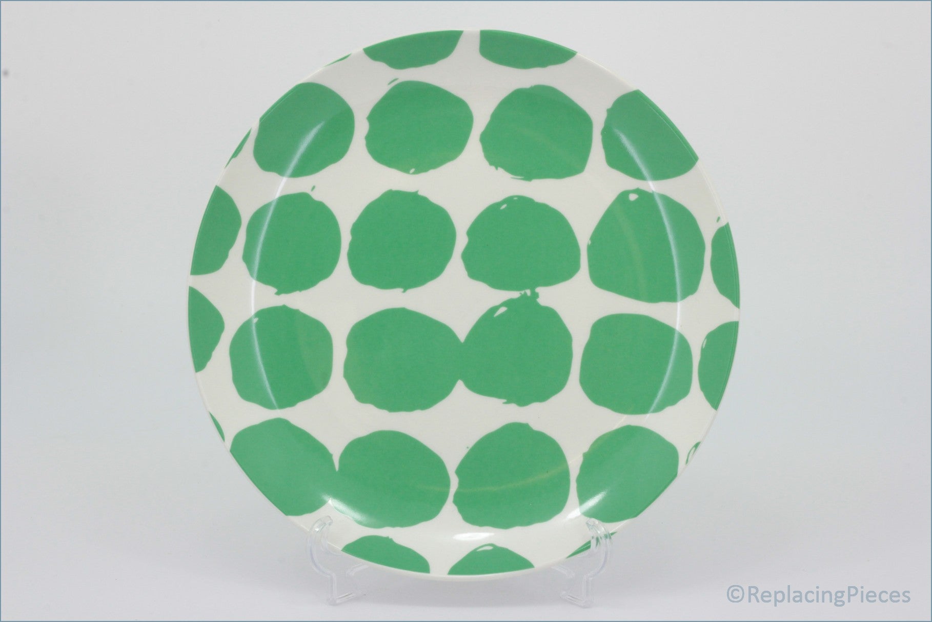 Habitat - Abstract - 8 1/4" Salad Plate - Round plate with green polka dot pattern on a white background