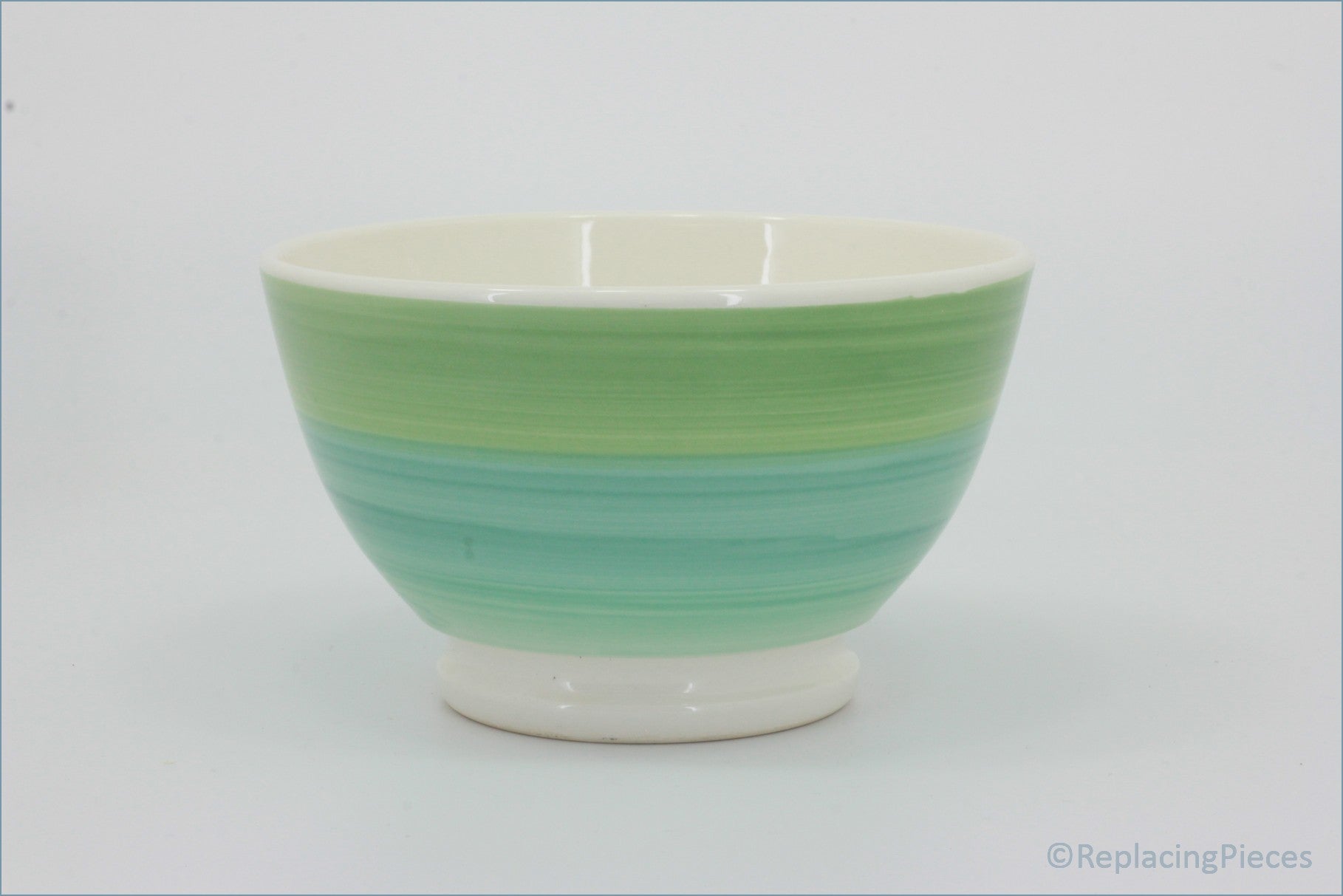 Habitat - Circles - Cereal Bowl  - Green and white ceramic bowl on a white background