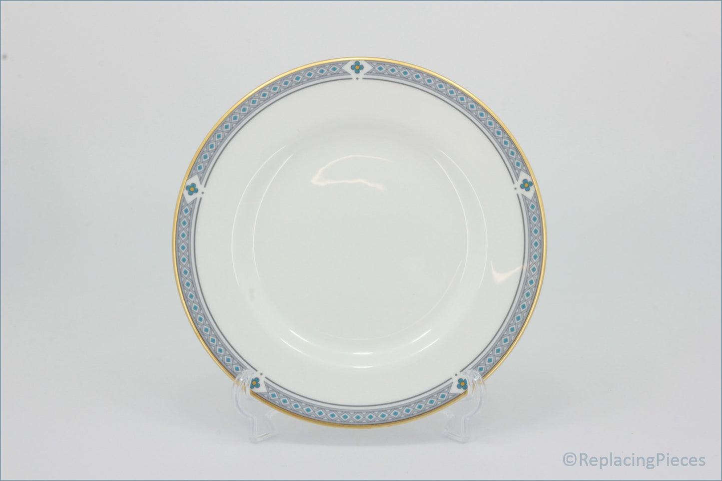 Marks & Spencer - Felsham - Dinner Plate - White ceramic plate with decorative gold and blue rim on a white background