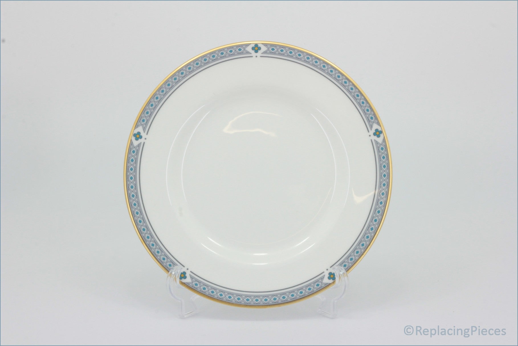 Marks & Spencer - Felsham - Dinner Plate - White ceramic plate with decorative gold and blue rim on a white background