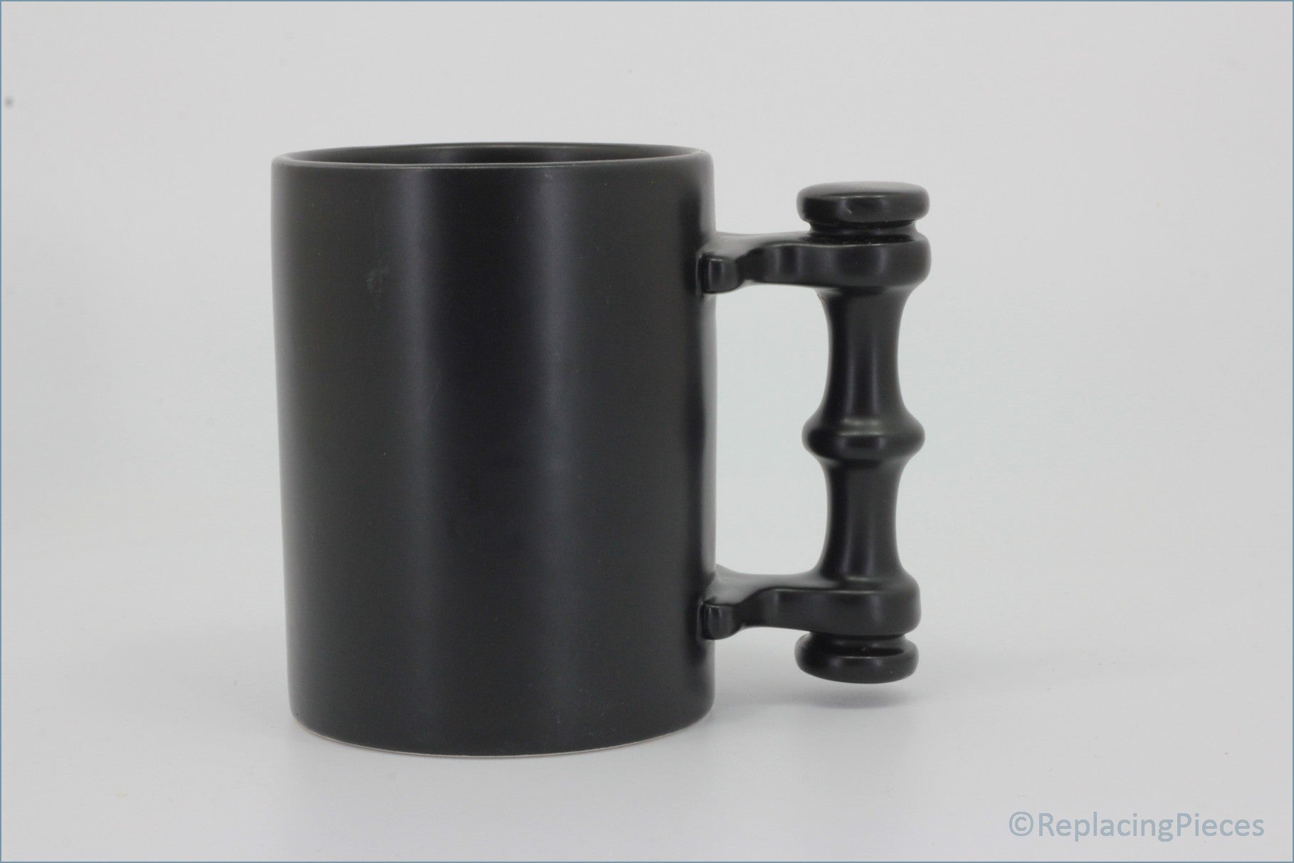 Portmeirion - Mugs - Plain Black Tankard - Black mug with a unique handle design on a white background