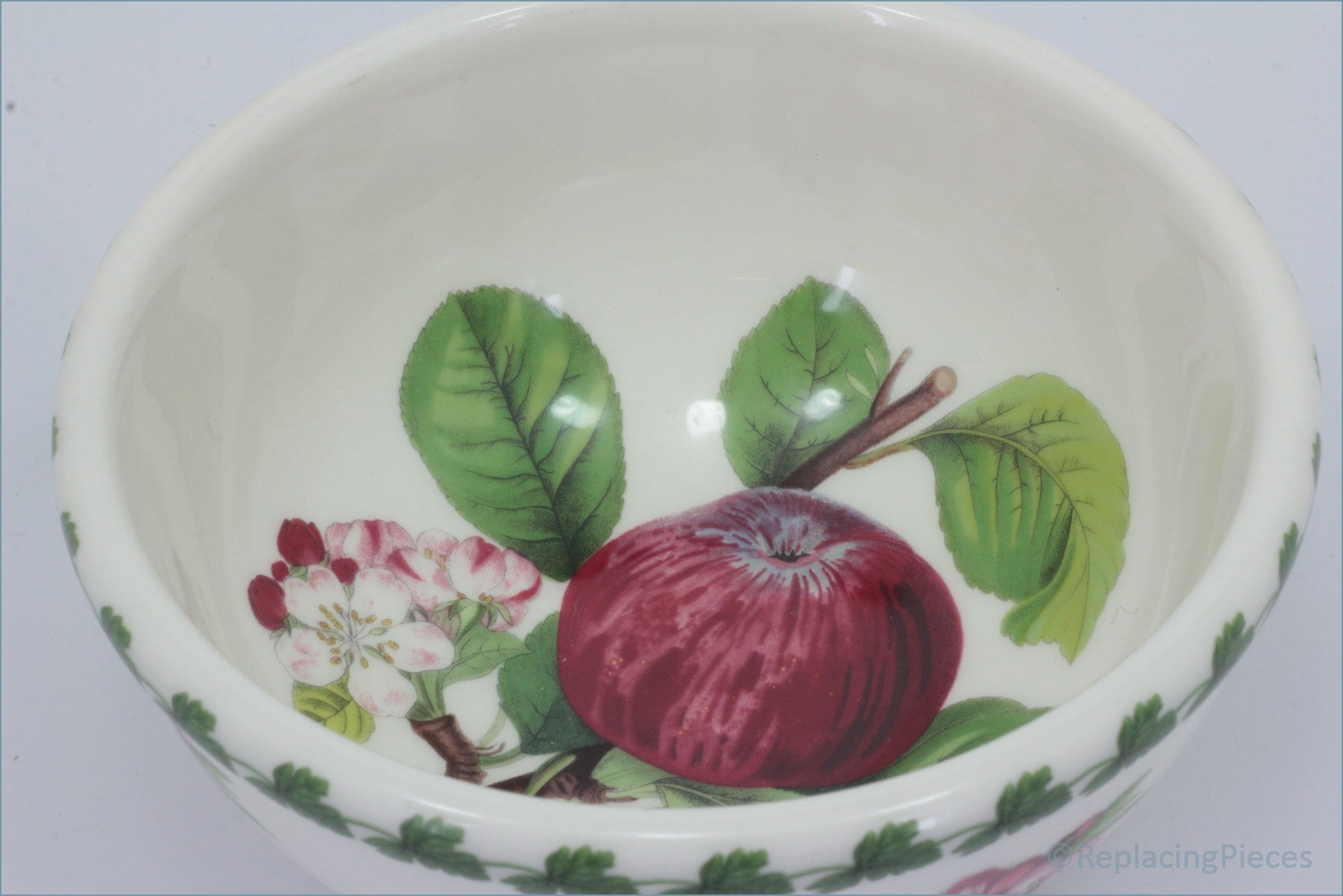 Ceramic bowl with apple and floral design on a white background - Portmeirion - Pomona - 5 1/2" Cereal Bowl (The Hoary Morning Apple)