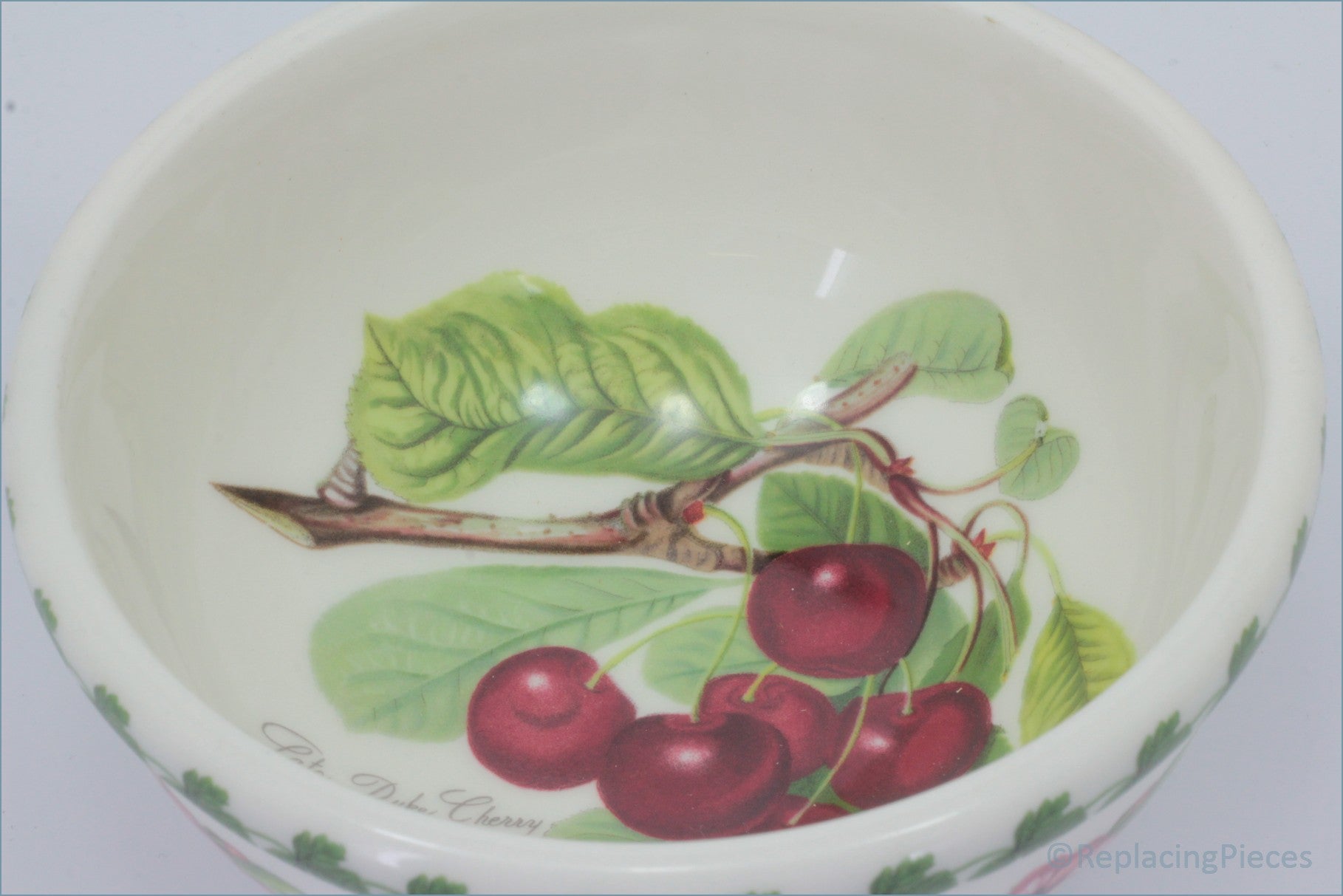 Ceramic bowl with cherry design on a white background - Portmeirion - Pomona - 5 1/2" Cereal Bowl (The Late Duke Cherry)