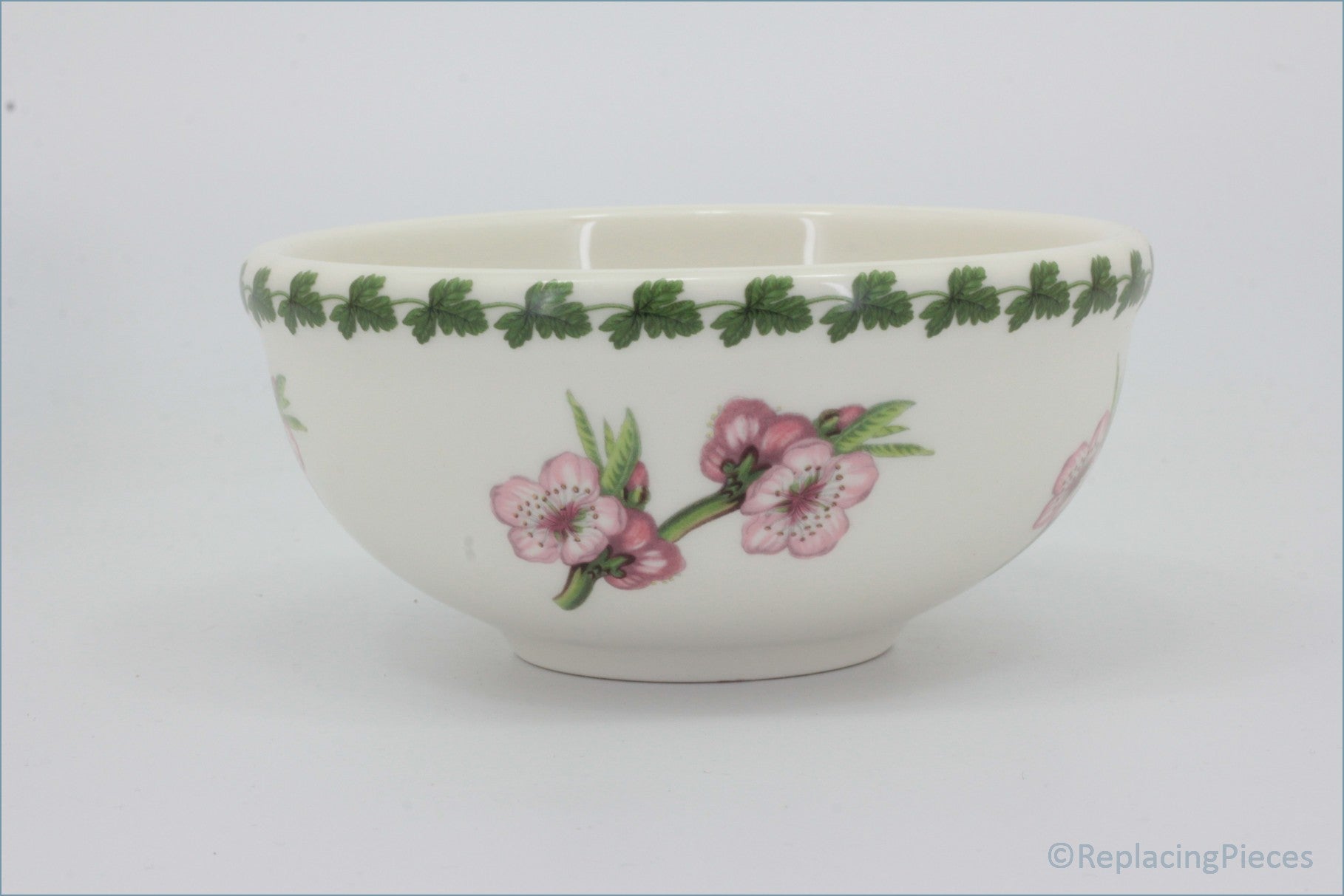 White ceramic bowl with floral design on a white background - Portmeirion - Pomona - 5 1/2" Cereal Bowl (The Late Duke Cherry)