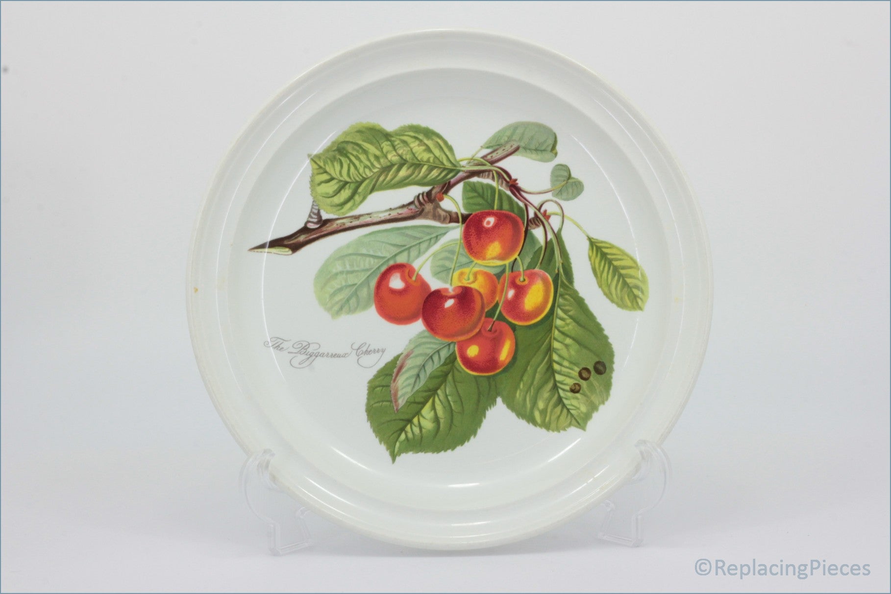 Decorative plate with a cherry design on a white background - Portmeirion - Pomona - Dinner Plate (The Biggarreux Cherry)