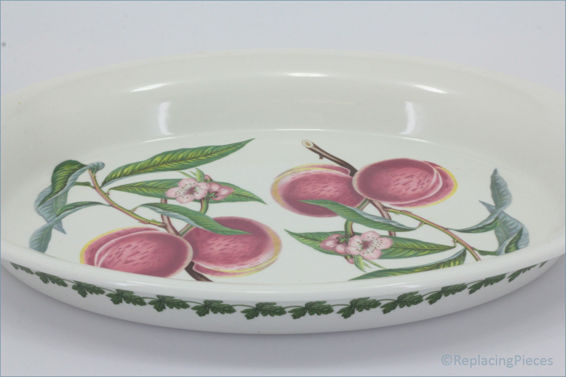 Portmeirion - Pomona - 15" Oval Handled Roaster (Grimwoods Royal George) - Decorative ceramic bowl with peach design on a white background