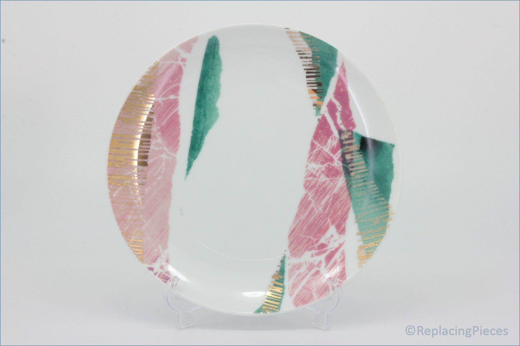Portmeirion - Torn - 7 5/8" Side Plate - Decorative glass piece with pink, green, and gold patterns on a white background