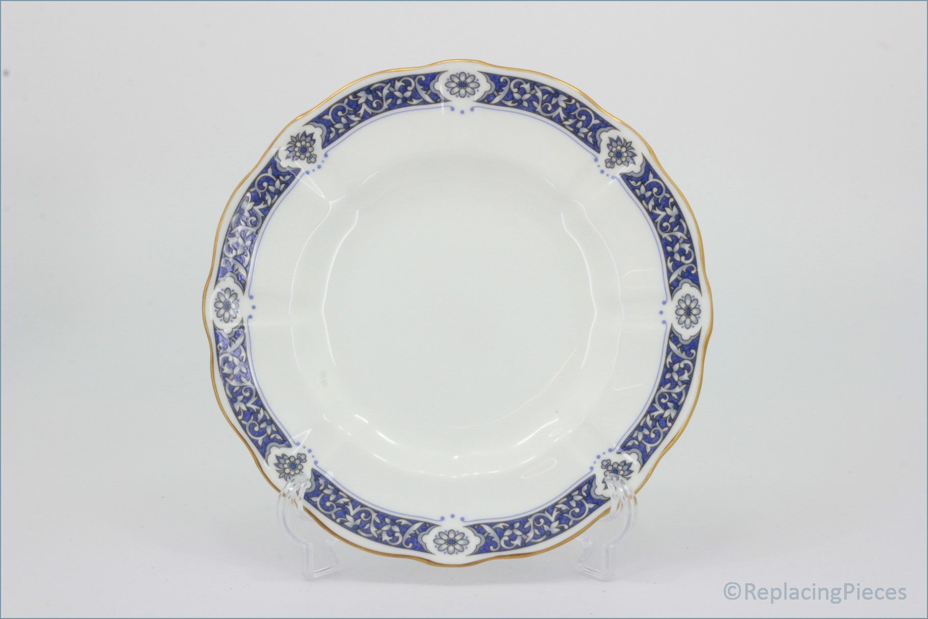 Royal Crown Derby - Milldale (A1326) - 6 1/2" Side Plate - White plate with blue and gold decorative rim on a white background