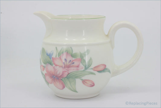 Royal Doulton - Carmel - Milk Jug - White ceramic pitcher with floral design on a white background