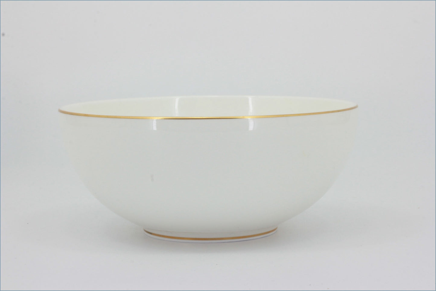 White ceramic bowl with gold rim on a light gray background - Royal Doulton - Symmetry Gold - Cereal Bowl