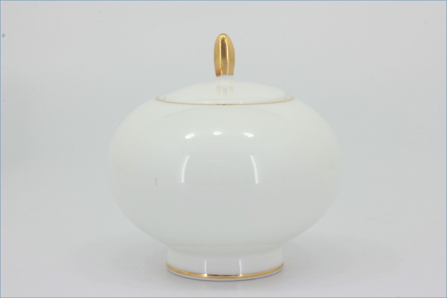 Royal Doulton - Symmetry Gold - Lidded Sugar Bowl - White ceramic jar with gold accents on a white background