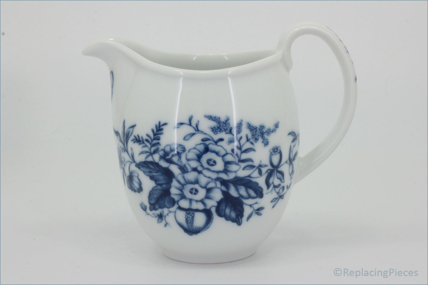 Royal Worcester - Hanbury - Milk Jug - White ceramic pitcher with blue floral pattern on a white background
