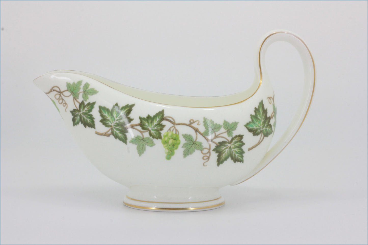 Wedgwood - Santa Clara - Gravy Boat - Decorative ceramic gravy boat with green leaf pattern on a white background